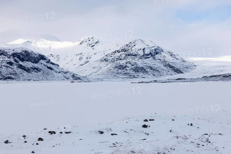 Lava rock field, mountain range, snow, winter, Vatnajökull region, Iceland, Scandinavia