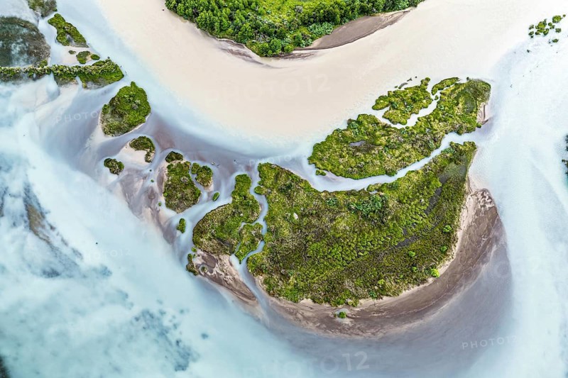 Aerial view over the branches of river Rio Ibanez, wide river landscape, muddy and blue glacial water, viewpoint Mirador Confluencia, west of Villa Cerro Castillo, Aysen, Chile