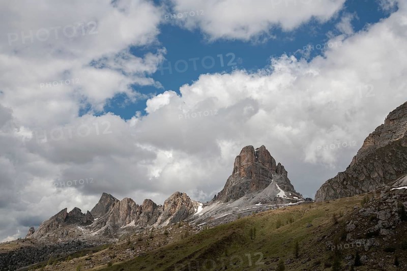 Breathtaking landscape of Passo Giau in the Dolomites, Italy. Majestic peaks rise against a backdrop of dramatic clouds, showcasing nature's grandeur and beauty