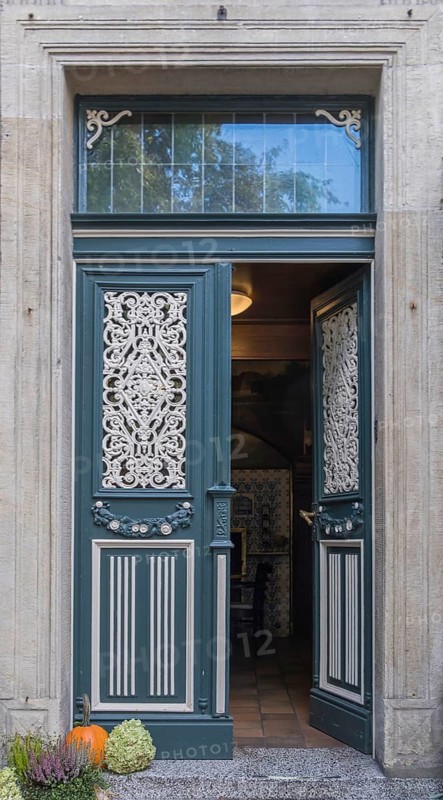 Old front door with decorative ironwork, Münsterland, North Rhine-Westphalia, Germany