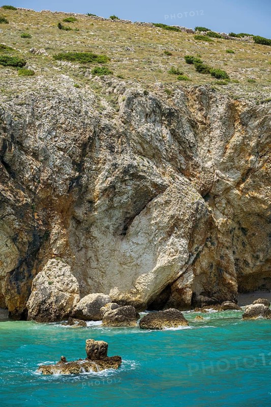 Romantic view over the sea in Koromacna Bay on a sunny day with rough seas on the island of Cres, long exposure, Croatia