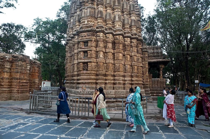 Female indian tourists are visiting the Bhoramdeo temple (Chhattisgarh, India) . The temple is a 11th shrine dedicated to the hindu god Shiva. The temple is renowned for its intricate carvings
