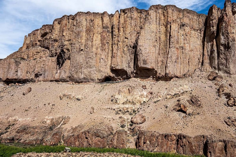 Guided tourist group visiting the Cueva de las Manos, Unesco World Heritage, caves with prehistoric paintings, group walks above the canyon of the Rio Pinturas river, Argentina