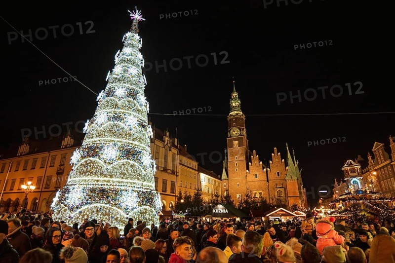 WROCLAW, POLAND - DECEMBER 08, 2018: Christmas fair in the market square of Wroclaw with the city hall and illumnated christmas tree