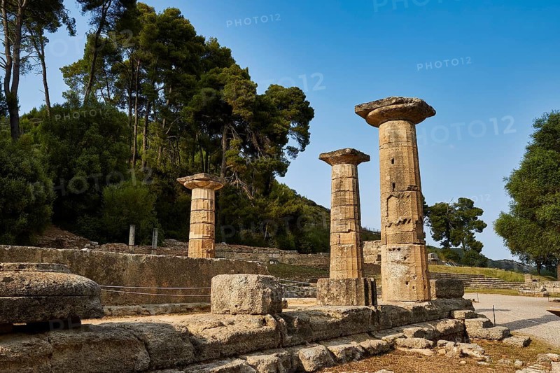 Temple of Hera, Heraion, Three preserved pillars in a historic site with a wooded background, Archaeological Site, Ancient Olympia, Olympia, Peloponnese, Greece