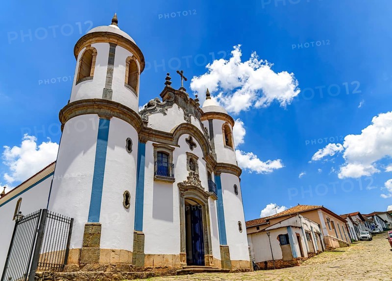 Street in the historic city of Congonhas in Minas Gerais with an old baroque church, Congonhas, Minas Gerais, Brazil