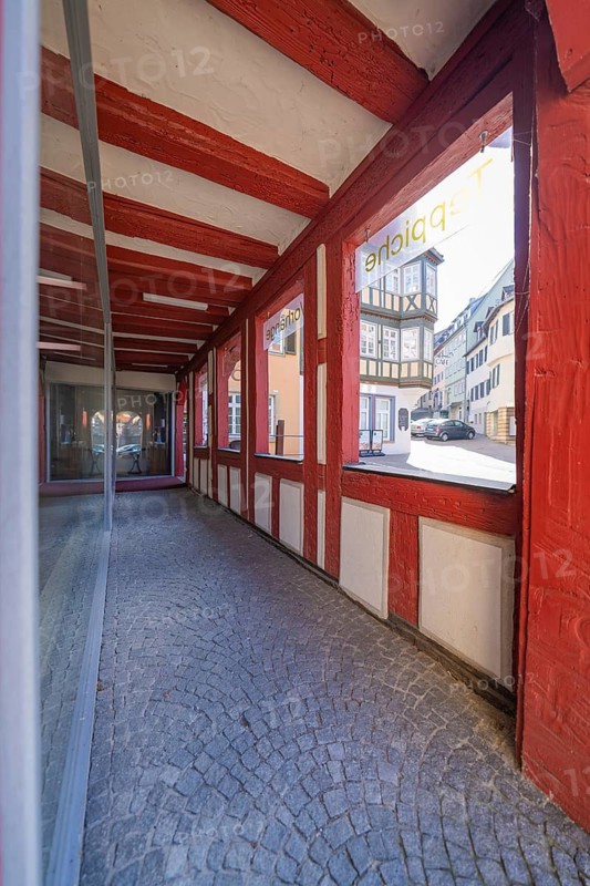 View through a covered passage with wooden and window elements, Schwäbisch Hall, Germany