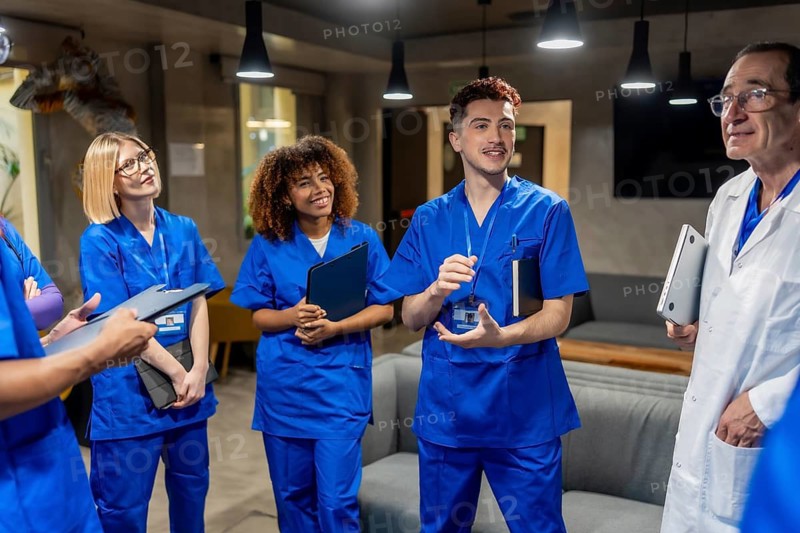 Diverse medical team members, including interns and an experienced doctor, collaborating in a hospital setting, reflecting on teamwork, ongoing education, and professional development in healthcare