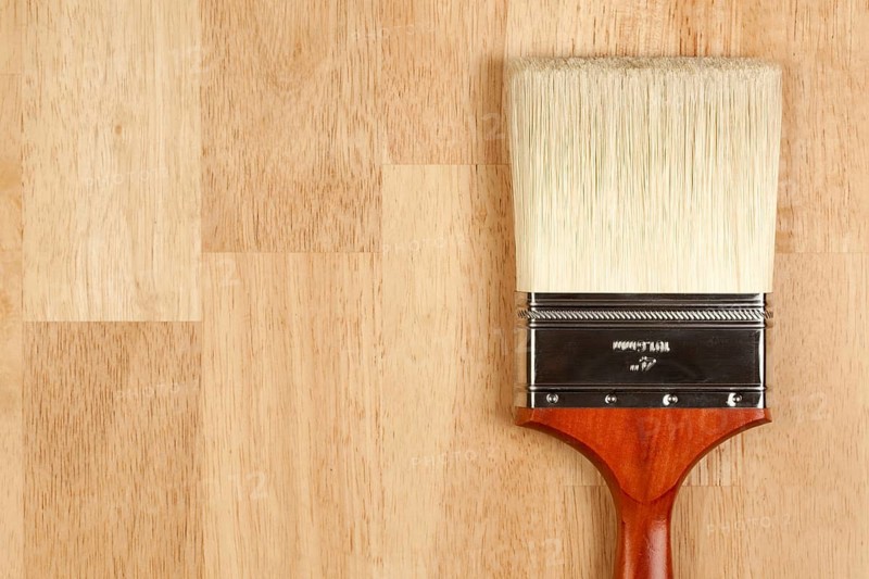 Paint Brush on a Wood Surface with Copy Room