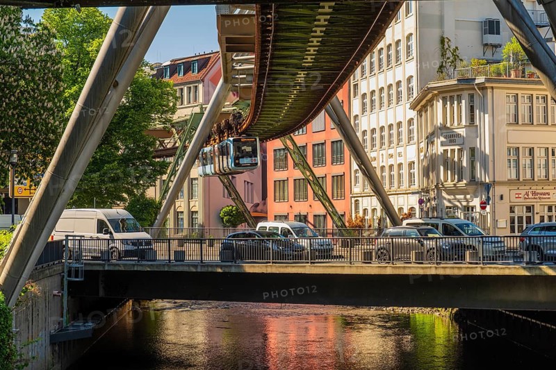 A suspension railway above a road with cars near the Kluse stop, Wuppertal, Germany