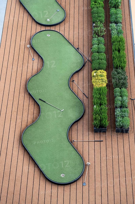 Outdoor deck, upper deck, open-air deck of a river cruise ship, putting green and shuffleboard game on deck