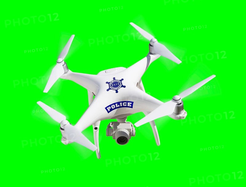 Police UAV unmanned aircraft system quadcopter drone flying over A green screen