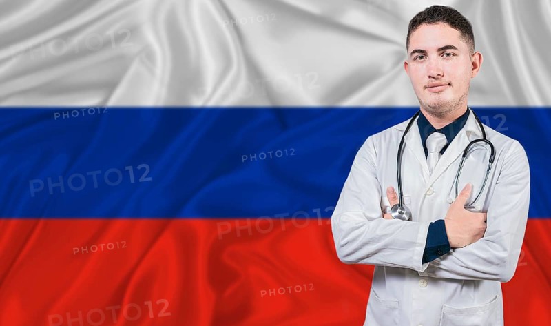 Portrait of medical professional on Russia flag background. Russian national health system
