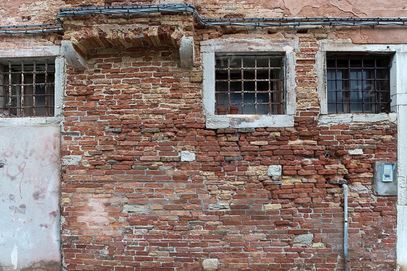 Old brick façade with lattice windows, Venice, Veneto, Italy