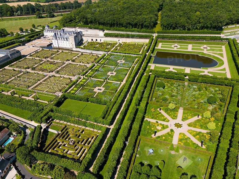 Overview of a castle with symmetrical, artistically designed gardens and parkland, aerial view, Villandry Castle, Renaissance, Tours, Loire Valley, Centre-Val de Loire, France
