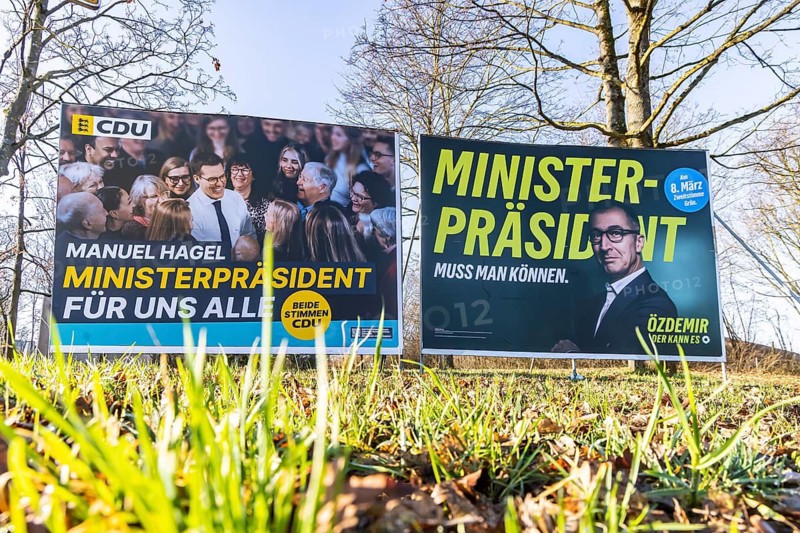2026 state election in Baden-Württemberg. Election posters at a crossroads in Fellbach. Large posters of the top candidates from CDU and Die Grünen side by side. Fellbach, Baden-Württemberg, Germany