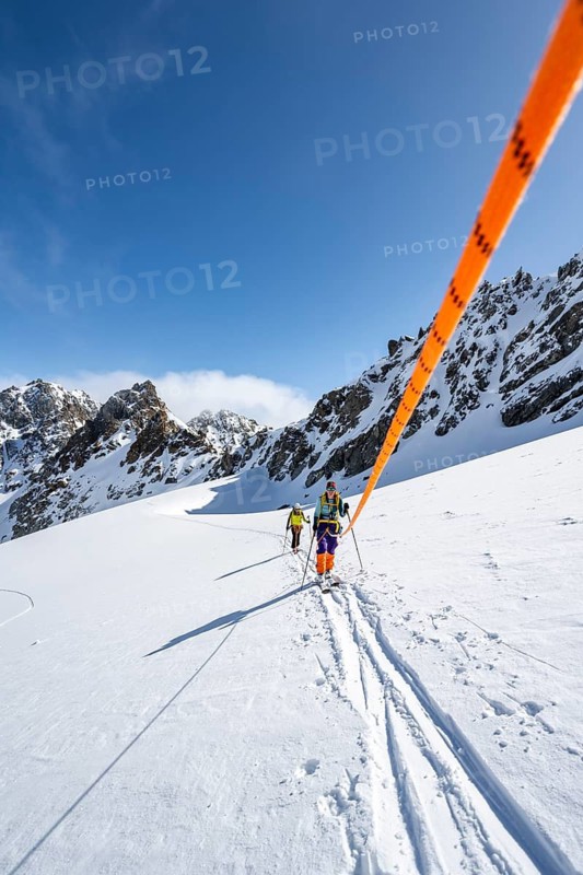 Ski tourer with rope, rope team on the Vadret da Porchabella glacier on the ascent to the summit of Piz Kesch, mountain landscape in winter, alpine tour, ski tour Bündner Haute Route, Albula Alps, Rhaetian Alps, Grisons, Eastern Switzerland, Switzerland
