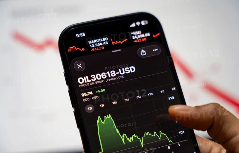 In this photo illustration, a smartphone displays the crude oil price in USD on March 09, 2026 in Guwahati, India. Global oil prices surged to their highest level since 2022 after escalating tensions in the US-Israel conflict with Iran raised concerns over potential disruptions to energy supplies, pushing Brent crude above Dollar 100 per barrel