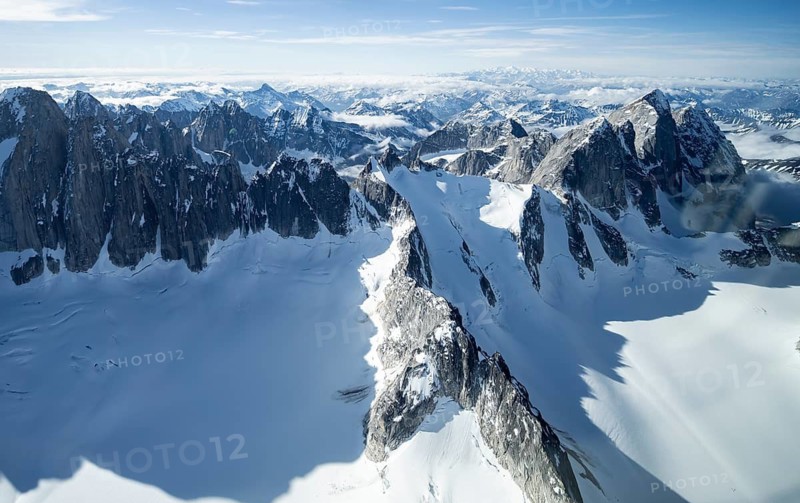 Rock cliffs, snow and ice, epic mountains with glaciers, aerial view, Alaska Range, Denali National Park, Alaska, USA