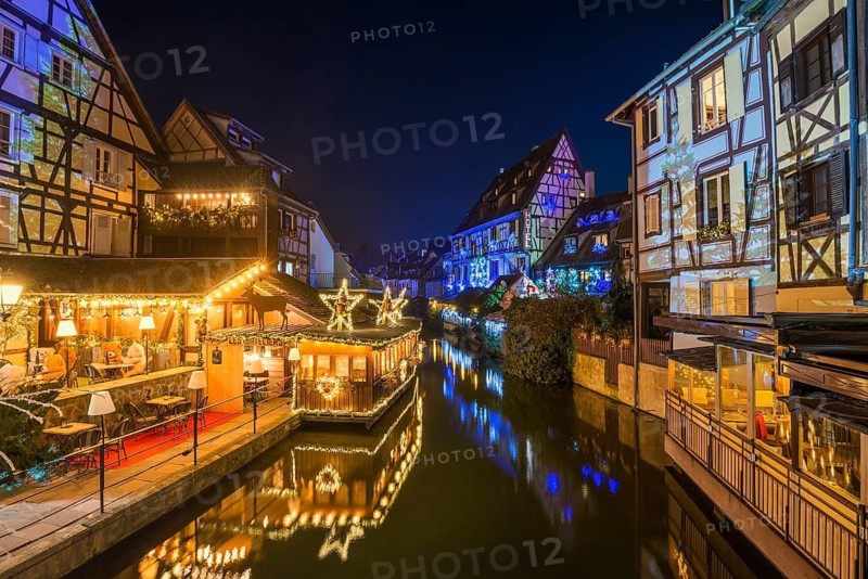 Colourfully illuminated and Christmassy decorated half-timbered houses, old town, blue hour, Colmar, Haut-Rhin department, Alsace, France