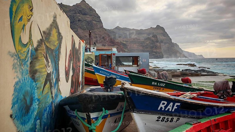 Fishing net and colorful boats on the coast with artistic walls, mural, graffiti and quiet evening mood at the fishing port, romantic, sunset, Ponta do Sol, Santo Antao, Cabo Verde, Cape Verde, Cape Verde