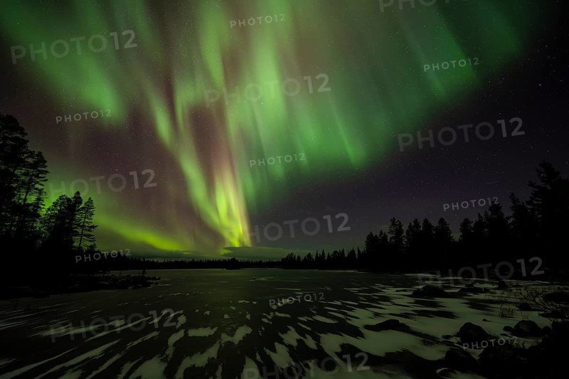 Northern Lights (Aurora borealis) over a frozen lake, Norrbotten, Lapland, Sweden, October 2022