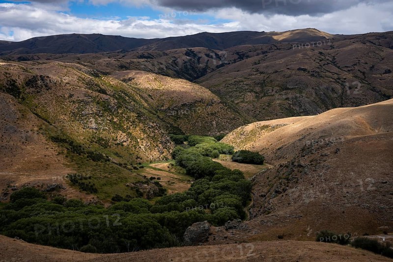 Landscape in New Zealand. View from Lindis Pass Tarras Road towards Cluden Creek Road. Lindis Valley, Otago, South Island, New Zealand