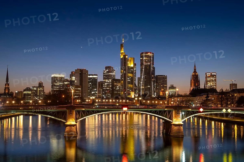 The lights of Frankfurt's banking skyline glow in the evening, Frankfurt am Main, Hesse, Germany