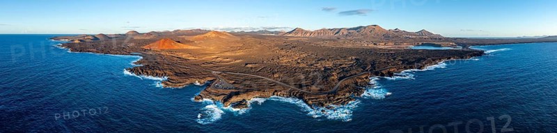 Coast with lava fields, volcanic landscape near Los Hervideros with red volcano Montaña Bermeja, in the evening light, aerial view, Lanzarote, Canary Islands, Spain