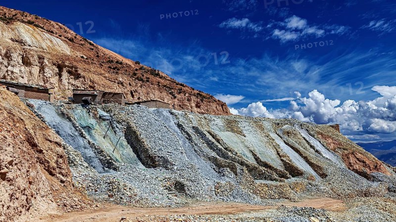 Wide quarry landscape with rocks and a blue, cloudy sky, The silver mines of Potosi on Cerro Rico in Bolivia