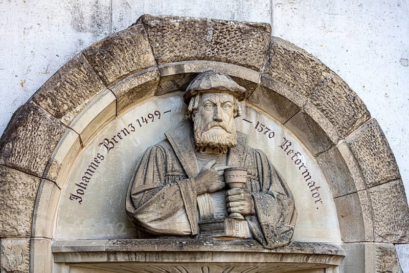 City view of Schwäbisch Hall. Bust of Halle reformer Johannes Brenz. Schwäbisch Hall, Baden-Württemberg, Germany