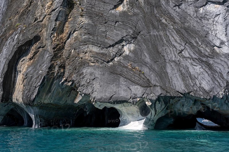 Marble caves (Capillas de Mármol) with eroded marble rock formations over turquoise-coloured water, General Carrera Lake, Aysén region, Chile
