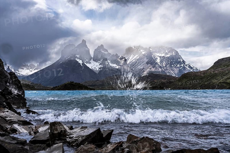 Cuernos del Paine, wind-whipped Lago Pehoé with spray and waves in the foreground, cloudy sky, Torres del Paine National Park, Magallanes region, Patagonia, Chile