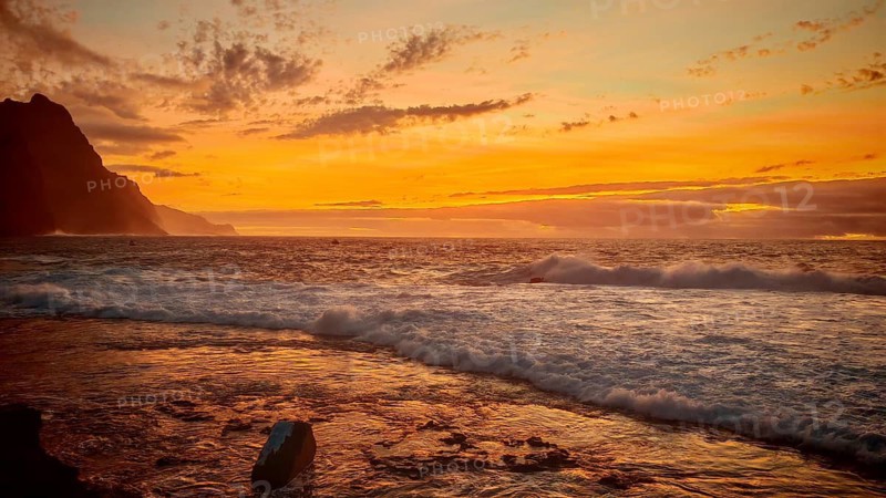 Ocean sunset with warm orange sky and calm waves, romantic, Ponta do Sol, Santo Antao, Cabo Verde, Cape Verde, Cape Verde