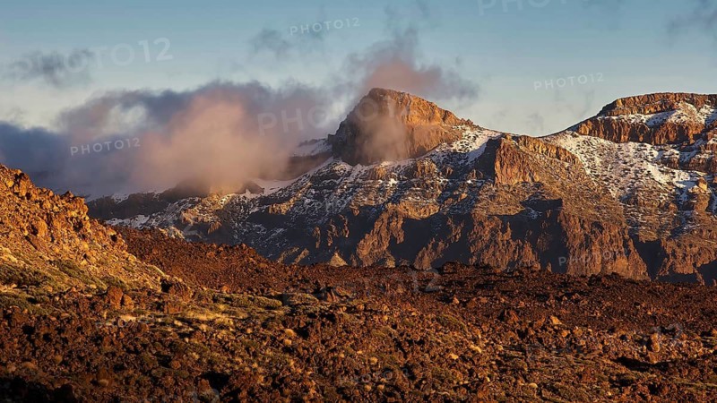 Mirador El Tabonal Negro, Caldera, cloud-covered mountain landscape in warm sunset with snow, Teide, Parque Nacional del Teide, Teide National Park, volcano, volcanism, UNESCO World Heritage Site, Tenerife, Canary Islands, Spain