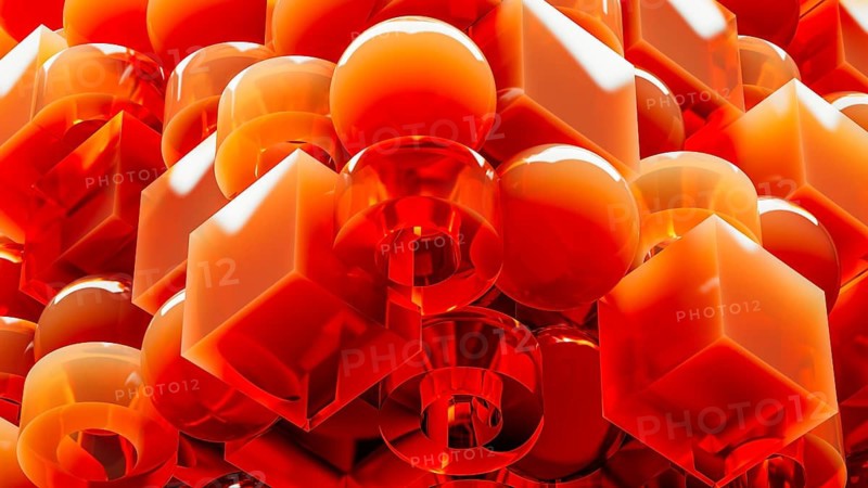 An engaging array of 3D geometric shapes in fiery orange tones combines spheres and cubes, creating a dynamic and visually stimulating design