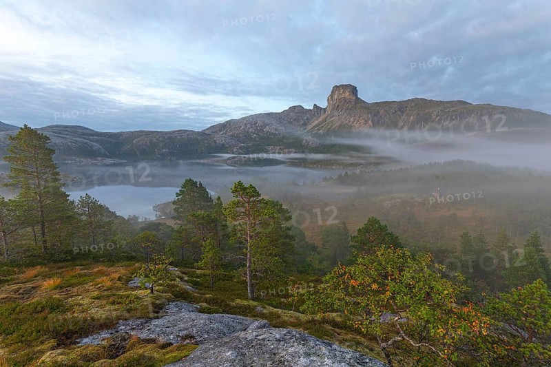 Magical morning fog on Steigtindvatnet in front of the majestic Steigtinden in Norway near Bodø