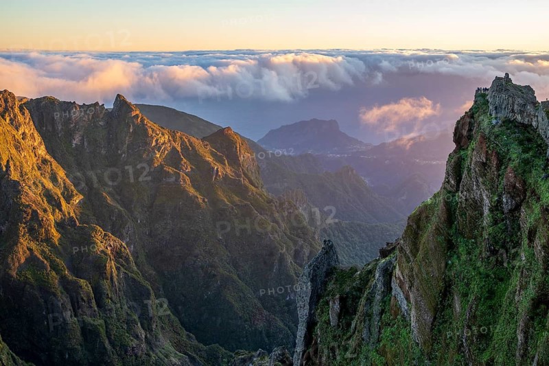 Sunrise at Pico do Arieiro, clouds of fog pass over mountain peaks, hiking trail PR1, Madeira, Portugal