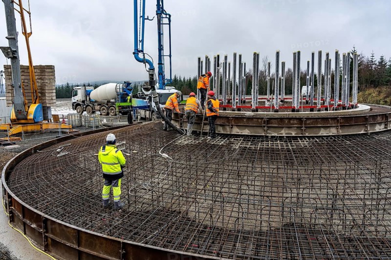 Concreting, concreting the foundation of a wind turbine, more than 600 cubic meters of concrete will be pumped into the foundation for over 7 hours, over 100 tons of reinforcing steel have been used, the wind turbine will have a hub height of 160 meters, part of a new wind farm in Sauerland, near Balve, North Rhine-Westphalia, Germany