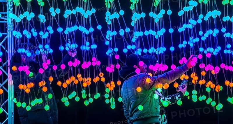 Park lights, winter event, in the Grugapark in Essen, many different light installations, across the park, attract many thousands of visitors, light work of art consisting of many hundreds of hanging ball lamps, LEDs, with changing colors, accessible, North Rhine-Westphalia, Germany