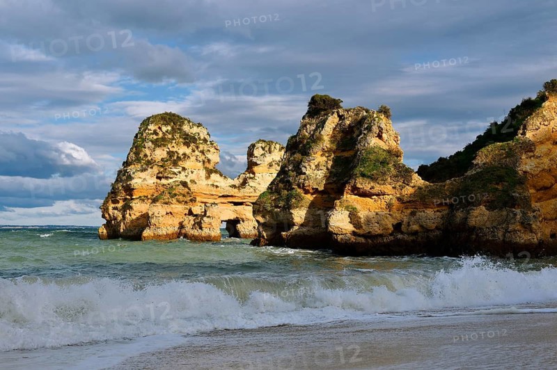 Rock formations on the coast in the evening light, Praia do Camilo, Lagos, Algarve, Portugal