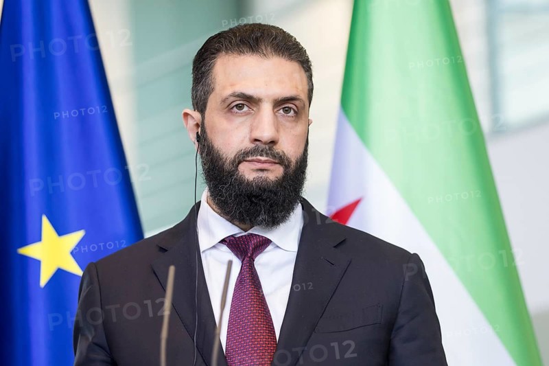 Ahmed al-Sharaa (President of the Syrian Arab Republic) at a joint press conference with Friedrich Merz (Chancellor of the Federal Republic of Germany, CDU) after a one-on-one meeting at the Federal Chancellery, Berlin, 30 March 2026