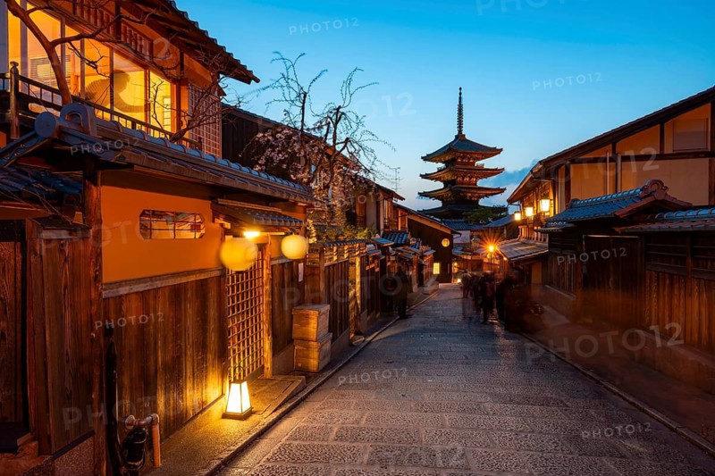 Yasaka dori historic street in the old town with traditional Japanese houses, five-story Yasaka Pagoda of the Buddhist Hokanji Temple at the back, evening mood, blue hour, Higashiyama, Kyoto, Japan