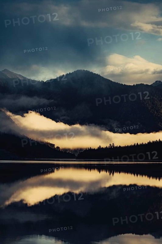 Sunrise with reflections in the Plansee in Tyrol in the Alps in Austria