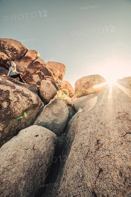 Woman hiking at sunrise in Joshua Tree National Park