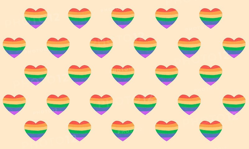 A pattern of heart shapes featuring rainbow colors on a beige background, symbolizing love and diversity. Perfect for themes of unity and pride awareness