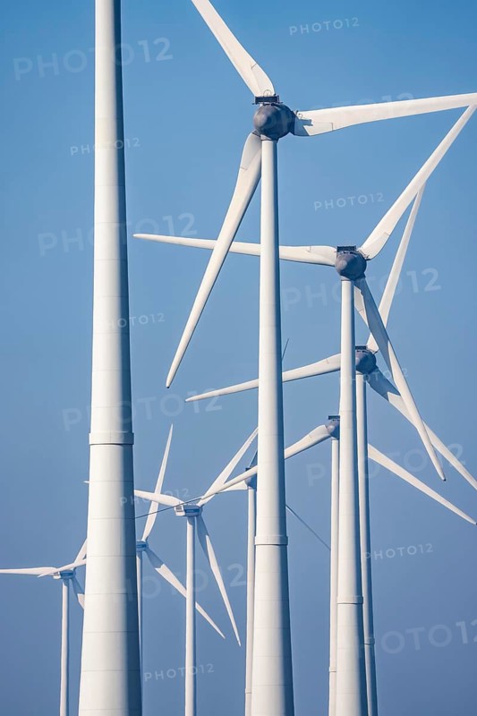 Wind farm in the north of the Netherlands, near Eemshaven, energy center, in addition to wind energy, there are coal and gas power plants and various energy infrastructure facilities here, Netherlands