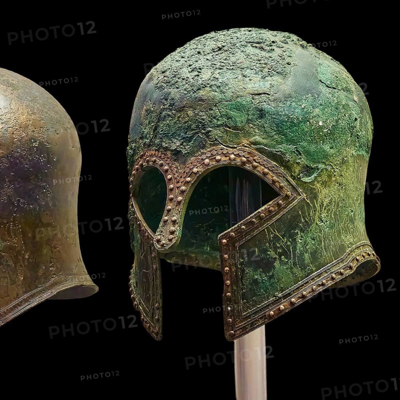 Corinthian bronze helmet, ancient Greek helmets with distinctive metal structures and greenish patina, Olympia Archaeological Museum, Ancient Olympia, Peloponnese, Greece