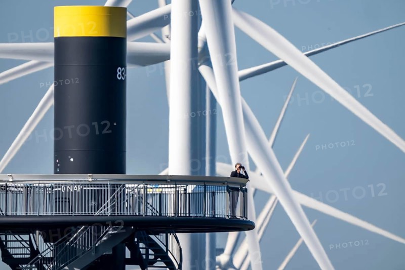 Viewing platform at Landtong Rozenburg wind farm, Noordzeeweg, Paal 83 watchtower 22 meters high, behind it 11 Vestas wind turbines, with an output of 34 MW and an annual result of 117 gigawatts, which corresponds to the consumption of approximately 43, 000 households, on a promontory on Nieuwe Waterweg, at Europoort harbour, hub height 130 meters, rotor diameter 26 meters, near Rotterdam, the Netherlands