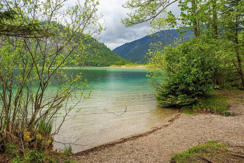 Landscape of Lake Offensee after rain when the sun comes through the clouds in spring, Salzkammergut, Austria